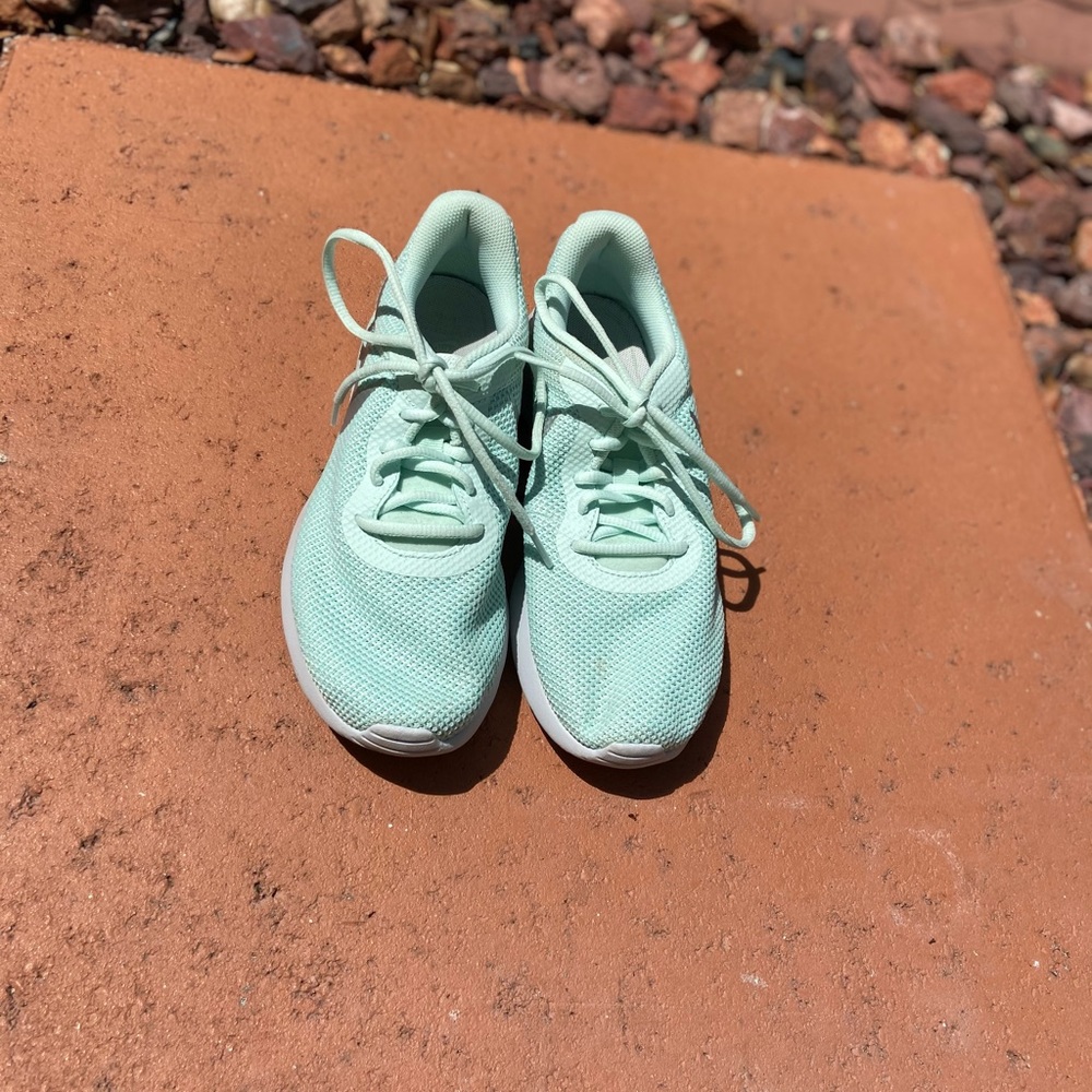 Teal Nike running shoes